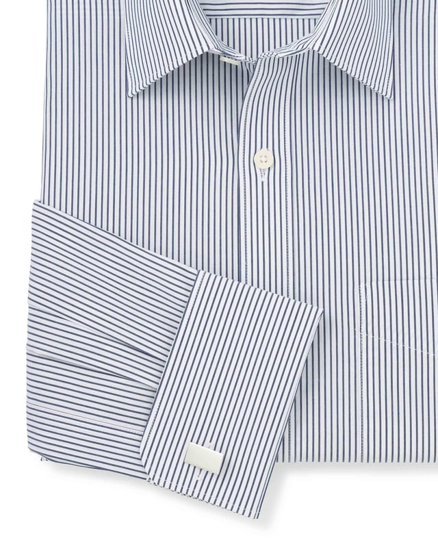 Complete with elegant double cuffs and a curl-resistant collar, this men's formal shirt deserves a place in every gentleman's wardrobe. The 100% cotton construction makes it beautifully soft and easy to care for, while the classic fit shape ensures it's suitable for all builds (especially if you like your shirts fairly roomy). Classic fit; generously proportioned shape. 100% BCI cotton poplin; easy care finish, smooth to the touch. Windsor collar with integral and removable collar stay. Split yoke, long tails, chest pocket. Presented in fully recyclable packaging. Machine washable at 40°C.