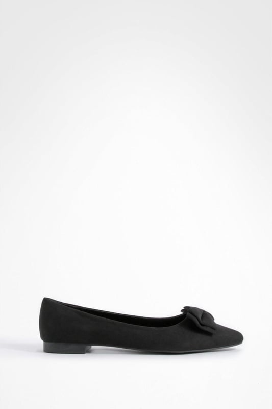 Charming bow detail adorns the toe
        Wide fit design for enhanced comfort
        Versatile round toe silhouette
        Flat sole for all-day wearability
        Soft synthetic suede upper for a luxe look
    
    Step out in style and comfort with these delightful wide fit ballerina flats. The eye-catching bow detail adds a touch of femininity to the classic round toe design, making these shoes a perfect blend of elegance and practicality. Ideal for the fashion-forward woman who values both style and comfort, these flats can effortlessly transition from day to night. Pair them with cropped trousers and a crisp white shirt for a polished office look, or team them with a flowy summer dress for a casual day out with friends. The versatile nature of these ballerinas makes them a wardrobe essential for various occasions, from family gatherings to impromptu coffee dates. With their wide fit and soft synthetic suede upper, these shoes promise to keep your feet feeling fabulous all day long, no matter where your adventures take you.
