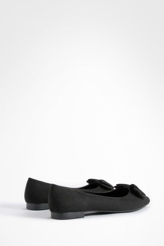 Charming bow detail adorns the toe
        Wide fit design for enhanced comfort
        Versatile round toe silhouette
        Flat sole for all-day wearability
        Soft synthetic suede upper for a luxe look
    
    Step out in style and comfort with these delightful wide fit ballerina flats. The eye-catching bow detail adds a touch of femininity to the classic round toe design, making these shoes a perfect blend of elegance and practicality. Ideal for the fashion-forward woman who values both style and comfort, these flats can effortlessly transition from day to night. Pair them with cropped trousers and a crisp white shirt for a polished office look, or team them with a flowy summer dress for a casual day out with friends. The versatile nature of these ballerinas makes them a wardrobe essential for various occasions, from family gatherings to impromptu coffee dates. With their wide fit and soft synthetic suede upper, these shoes promise to keep your feet feeling fabulous all day long, no matter where your adventures take you.