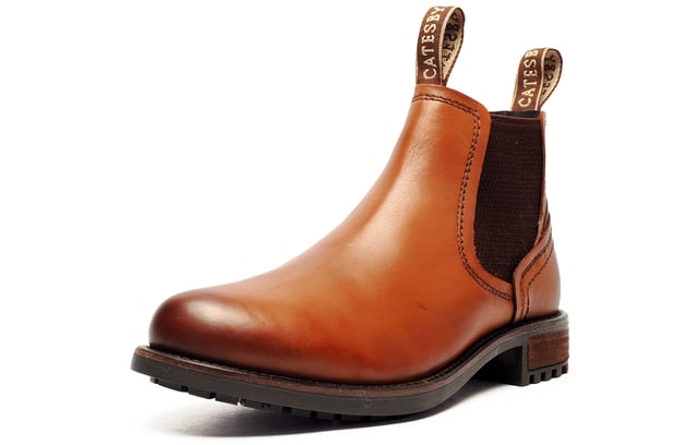 Catesby England was founded in 1970 with a vision and dedication focused on quality, craftsmanship, and a fine attention to detail. From its modest beginnings in a countryside workshop, Catesby England grew into a name synonymous with classic English footwear, blending heritage with modern craftsmanship, manufactured from the finest leathers to ensure durability, comfort, and effortless style.
 The SE Catesby Ryburn Mens Dealer Boots offer a sophisticated yet versatile design, making them ideal for both casual and semi-formal occasions. Expertly crafted from premium high end leather, these boots blend timeless style with modern functionality.
 Designed for convenience and comfort, they feature elastic side panels for a snug, flexible fit, while dual pull-on loops ensure easy on-and-off wear. The durable rubber outsole provides excellent traction and stability, keeping you comfortable and confident throughout the day.
 Perfect for the modern man who values both elegance and practicality, the SE Ryburn Leather Boots are a stylish go-towhether you're heading to the office, stepping out for the weekend, or simply elevating your everyday look.
 - Premium leather boots
 - Elasticated side gussets
 - Slip on design 
 - Dual pull on loops
 - Cushioned insole
 - Highly durable outsole
 - Catesby branding
 
 Please Note: There may be a sticky effect around the welt of the shoe which will wipe clean with a finger or smooth damp cloth. This is nothing more than residue which has been caused by humidity or storage during transportation.