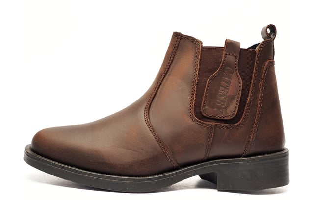 Catesby England was founded in 1970 with a vision and dedication focused on quality, craftsmanship, and a fine attention to detail. From its modest beginnings in a countryside workshop, Catesby England grew into a name synonymous with classic English footwear, blending heritage with modern craftsmanship, manufactured from the finest leathers to ensure durability, comfort, and effortless style.
 Part of the distinguished Catesby Collection, these dealer boots are the epitome of timeless elegance and practical designideal for both casual wear and smart-casual occasions.
 Built with Goodyear welted construction, these boots are renowned for their durability, strength, and ease of wear. This traditional method involves stitching the leather upper, leather lining, and a specially crafted leather welt to a ribbing bonded to the insolecreating a robust, long-lasting foundation.
 Crafted from high-quality genuine leather, the SE boots exude a classic look while delivering modern functionality. Elastic side panels provide a secure and flexible fit, and a pull-on loop ensures easy wear. Finished with a durable rubber outsole, these boots offer reliable traction and all-day comfortperfect for life on the move.
 - Goodyear welted construction for strength & durability
 - Leather upper
 - Elastic side panels for a flexible, snug fit
 - Pull-on loop for effortless wear
 - Durable rubber outsole
 - Catesby branding