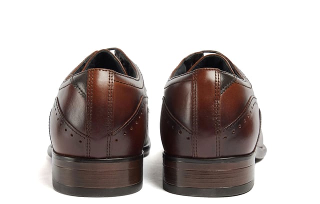 Introducing the Ralph, a sophisticated toe-cap Oxford style crafted from premium Italian leather, meticulously finished to deliver a rich, deep color. Elevate your formal attire with the closed Oxford lace-up closure, while the concealed padded collar and tongue enhance comfort. The Ortholite foam insole offers long-lasting cushioning and breathability, ensuring your feet stay comfortable throughout the day. The Ralph is the perfect blend of timeless style and modern comfort.- Premium Italian leather upper- Lace-up closure- Concealed padded collar and tongue- Ortholite foam insole