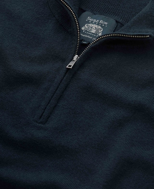 Wrap yourself in unparalleled comfort with this navy quarter zip jumper, crafted from 12-gauge extra-fine non-mulesed Merino wool in navy. The exquisitely soft knit is not only wonderfully warm but also incredibly breathable, making it the ideal layering piece for all seasons. The refined ¼ zip neck adds versatility, allowing you to wear it zipped up for a sharp, sleek finish or open for a more relaxed, effortless look. Luxurious in both feel and appearance, this men's jumper is designed for those who appreciate the finer things in life. 100% Merino wool. 12 gauge extra fine non mulesed merino. Fully fashioned sleeve. Quarter neck zip neck opening. Regular fit. Can be hand washed at 30°C inside out. Reshape whilst wet and dry flat. Do not bleach or tumble dry. Can be dry cleaned. Packaged in a fully recycled bag.