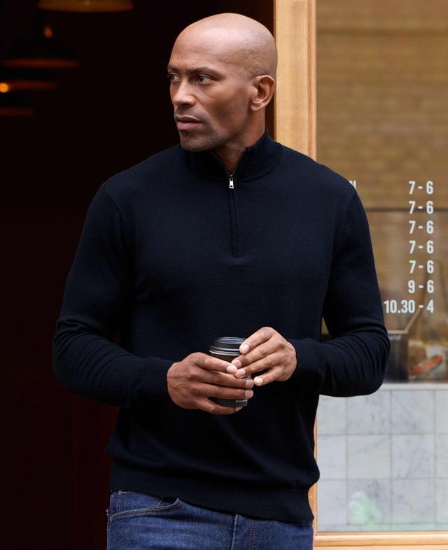 Wrap yourself in unparalleled comfort with this navy quarter zip jumper, crafted from 12-gauge extra-fine non-mulesed Merino wool in navy. The exquisitely soft knit is not only wonderfully warm but also incredibly breathable, making it the ideal layering piece for all seasons. The refined ¼ zip neck adds versatility, allowing you to wear it zipped up for a sharp, sleek finish or open for a more relaxed, effortless look. Luxurious in both feel and appearance, this men's jumper is designed for those who appreciate the finer things in life. 100% Merino wool. 12 gauge extra fine non mulesed merino. Fully fashioned sleeve. Quarter neck zip neck opening. Regular fit. Can be hand washed at 30°C inside out. Reshape whilst wet and dry flat. Do not bleach or tumble dry. Can be dry cleaned. Packaged in a fully recycled bag.