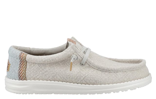 These Hey Dude Wally Jute Shoes bring a natural touch to your warm-weather wardrobe. Made from 100% jute, these shoes are lightweight, breathable, and perfect for spring and summer adventures. Designed with a textile upper, cork heel, and woven gradient heel webbing, they combine effortless style with unbeatable comfort. The elastic laces and easy-on system make them travel-friendly, while the removable foam insole ensures all-day cushioning. A flexible outsole adds the finishing touch for comfort on the go.
  Textile upper 
  Cork heel 
  Elastic laces for easy on/off wear 
  Travel-ready design with removable foam insole
  Lightweight flexible outsole for all-day comfort
  Hey Dude branding
