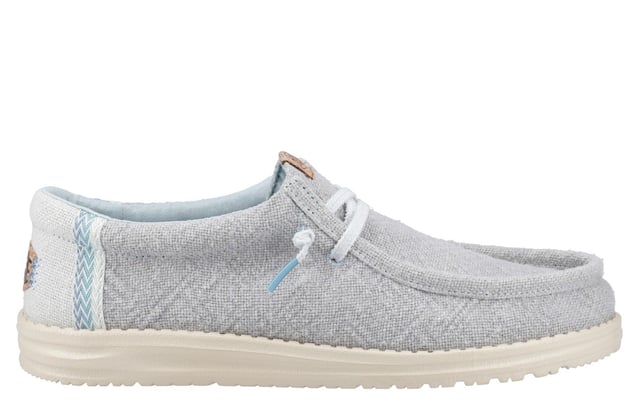 These Hey Dude Wally Jute Shoes bring a natural touch to your warm-weather wardrobe. Made from 100% jute, these shoes are lightweight, breathable, and perfect for spring and summer adventures. Designed with a textile upper, cork heel, and woven gradient heel webbing, they combine effortless style with unbeatable comfort. The elastic laces and easy-on system make them travel-friendly, while the removable foam insole ensures all-day cushioning. A flexible outsole adds the finishing touch for comfort on the go.
  Textile upper 
  Cork heel 
  Elastic laces for easy on/off wear 
  Travel-ready design with removable foam insole
  Lightweight flexible outsole for all-day comfort
  Hey Dude branding