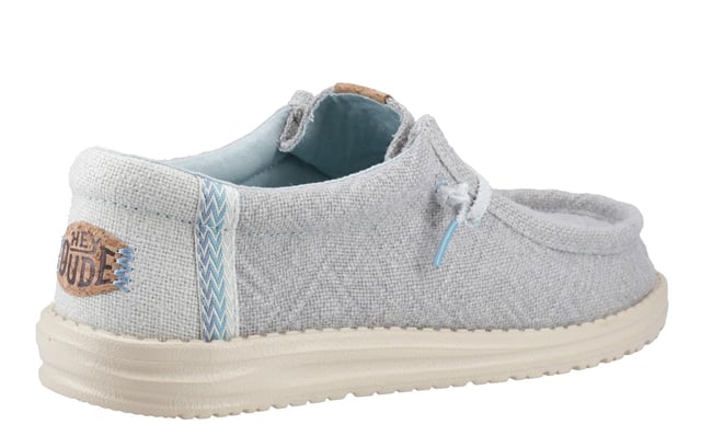 These Hey Dude Wally Jute Shoes bring a natural touch to your warm-weather wardrobe. Made from 100% jute, these shoes are lightweight, breathable, and perfect for spring and summer adventures. Designed with a textile upper, cork heel, and woven gradient heel webbing, they combine effortless style with unbeatable comfort. The elastic laces and easy-on system make them travel-friendly, while the removable foam insole ensures all-day cushioning. A flexible outsole adds the finishing touch for comfort on the go.
  Textile upper 
  Cork heel 
  Elastic laces for easy on/off wear 
  Travel-ready design with removable foam insole
  Lightweight flexible outsole for all-day comfort
  Hey Dude branding