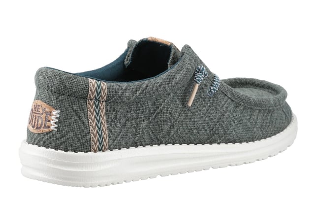These Hey Dude Wally Jute Shoes bring a natural touch to your warm-weather wardrobe. Made from 100% jute, these shoes are lightweight, breathable, and perfect for spring and summer adventures. Designed with a textile upper, cork heel, and woven gradient heel webbing, they combine effortless style with unbeatable comfort. The elastic laces and easy-on system make them travel-friendly, while the removable foam insole ensures all-day cushioning. A flexible outsole adds the finishing touch for comfort on the go.
  Textile upper 
  Cork heel 
  Elastic laces for easy on/off wear 
  Travel-ready design with removable foam insole
  Lightweight flexible outsole for all-day comfort
  Hey Dude branding