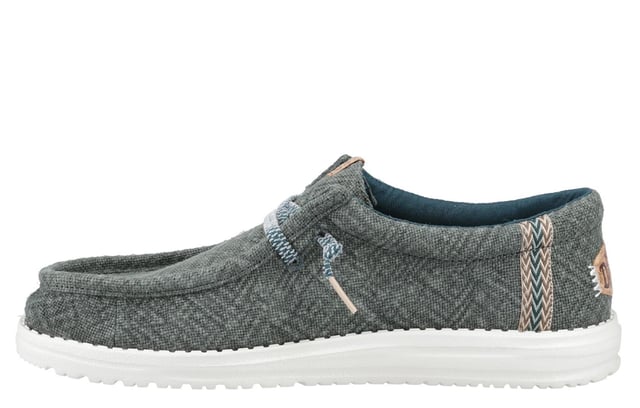 These Hey Dude Wally Jute Shoes bring a natural touch to your warm-weather wardrobe. Made from 100% jute, these shoes are lightweight, breathable, and perfect for spring and summer adventures. Designed with a textile upper, cork heel, and woven gradient heel webbing, they combine effortless style with unbeatable comfort. The elastic laces and easy-on system make them travel-friendly, while the removable foam insole ensures all-day cushioning. A flexible outsole adds the finishing touch for comfort on the go.
  Textile upper 
  Cork heel 
  Elastic laces for easy on/off wear 
  Travel-ready design with removable foam insole
  Lightweight flexible outsole for all-day comfort
  Hey Dude branding