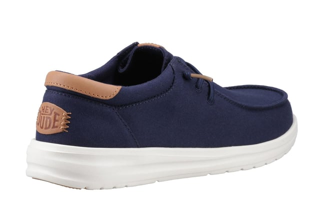 The Hey Dude Paul Shoes combine lightweight comfort with elevated casual styleperfect for wherever the day takes you. Designed with a soft canvas upper, leather detailing, and cushioned interior, they bring an upgraded look to everyday wear. The easy-on system and elastic laces make slipping them on a breeze, while the lightweight rubber traction outsole delivers featherweight comfort and reliable grip. Whether you're heading out for travel or just keeping it casual, these shoes are built to keep you moving with ease.
  Soft canvas upper with leather accents 
  Elastic laces for easy on/off wear 
  Removable foam insole for cushioned comfort
  Lightweight rubber traction outsole for grip and flexibility
  Hey Dude branding
