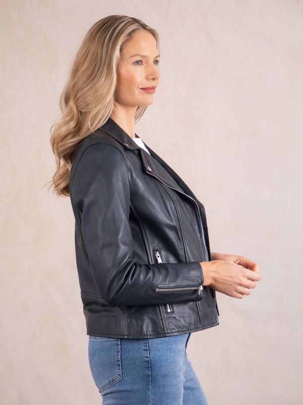 Tarraby Leather Biker Jacket in Navy A timeless outerwear essential, the Tarraby reimagines the classic biker jacket with refined detailing for any occasion. Crafted from supple semi aniline leather, the Tarraby is effortlessly versatile, able to be dressed up or down as needed. Featuring an asymmetric zip fastening and iconic biker lapels and collar, it’s tailored to enhance your natural curves, creating a flattering, stylish silhouette.