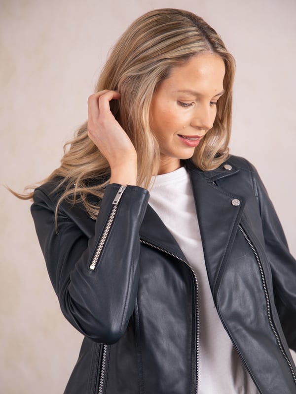 Tarraby Leather Biker Jacket in Navy A timeless outerwear essential, the Tarraby reimagines the classic biker jacket with refined detailing for any occasion. Crafted from supple semi aniline leather, the Tarraby is effortlessly versatile, able to be dressed up or down as needed. Featuring an asymmetric zip fastening and iconic biker lapels and collar, it’s tailored to enhance your natural curves, creating a flattering, stylish silhouette.