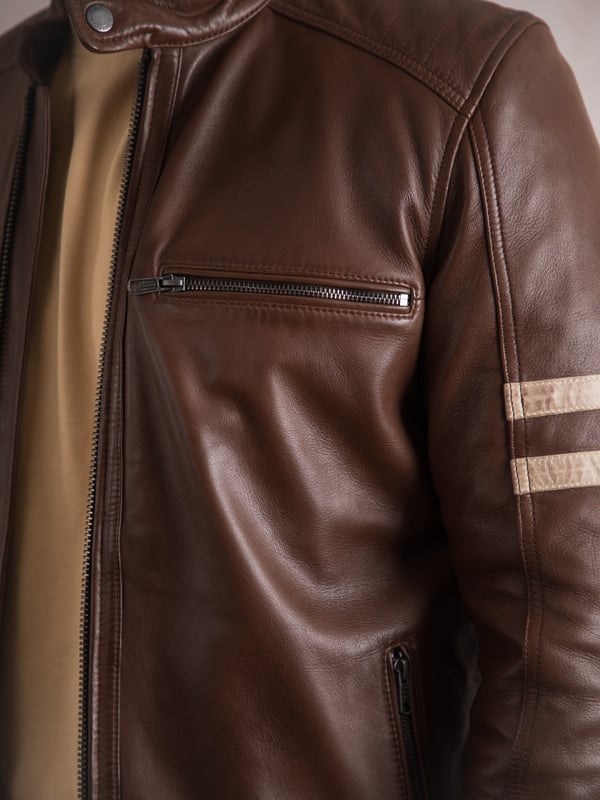 Our talented designers have taken our bestselling Charlie leather jacket and given it some subtle updates for the new season.
This classic racer style boasts a press stud collar and cuffs, as well as handy zip pockets complete with heritage-branded hardware.
A streamlined and pared back take on its predecessor, Charlie II still features aged-look contrasting leather stripes and understated shoulder stitch detailing.
While we&rsquo;ve introduced some subtle design updates, Charlie II remains crafted from the finest quality aniline leather, retaining a premium feel and sharp finish that will age beautifully with wear.