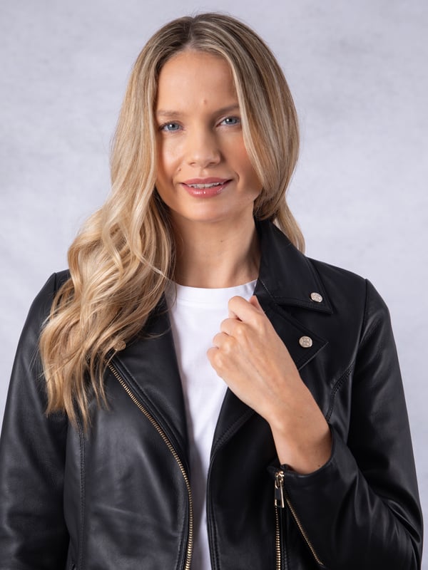 Knotts Leather Biker Jacket in Black The Knotts biker is a fresh update to the much-loved Kylee style, now introduced in two versatile shades.
Crafted from the finest semi aniline leather, this jacket embodies Lakeland Leather's commitment to quality and timeless design. It retains the iconic biker jacket elements, including an asymmetrical zip fastening, classic lapels, as well as sleek tonal hardware.
With its slightly longer length, the Knotts jacket is as versatile as it is flattering. Effortlessly pair it with jeans for a relaxed edge or drape it over a flowing dress for a chic contrast. Designed to suit all ages and seasons, this is a wardrobe essential with enduring appeal.