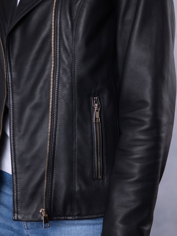 Knotts Leather Biker Jacket in Black The Knotts biker is a fresh update to the much-loved Kylee style, now introduced in two versatile shades.
Crafted from the finest semi aniline leather, this jacket embodies Lakeland Leather's commitment to quality and timeless design. It retains the iconic biker jacket elements, including an asymmetrical zip fastening, classic lapels, as well as sleek tonal hardware.
With its slightly longer length, the Knotts jacket is as versatile as it is flattering. Effortlessly pair it with jeans for a relaxed edge or drape it over a flowing dress for a chic contrast. Designed to suit all ages and seasons, this is a wardrobe essential with enduring appeal.