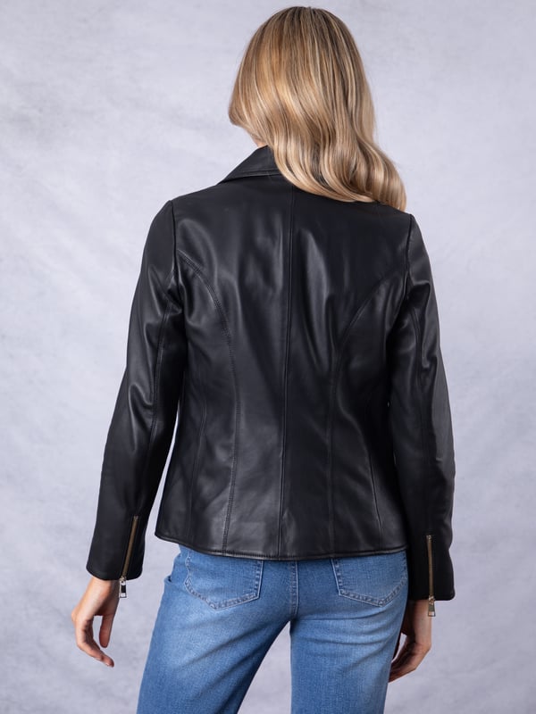 Knotts Leather Biker Jacket in Black The Knotts biker is a fresh update to the much-loved Kylee style, now introduced in two versatile shades.
Crafted from the finest semi aniline leather, this jacket embodies Lakeland Leather's commitment to quality and timeless design. It retains the iconic biker jacket elements, including an asymmetrical zip fastening, classic lapels, as well as sleek tonal hardware.
With its slightly longer length, the Knotts jacket is as versatile as it is flattering. Effortlessly pair it with jeans for a relaxed edge or drape it over a flowing dress for a chic contrast. Designed to suit all ages and seasons, this is a wardrobe essential with enduring appeal.