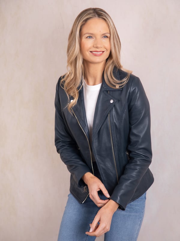 Knotts Leather Biker Jacket in Navy Blue The Knotts biker is a fresh update to the much-loved Kylee style, now introduced in two versatile shades.
Crafted from the finest semi aniline leather, this jacket embodies Lakeland Leather's commitment to quality and timeless design. It retains the iconic biker jacket elements, including an asymmetrical zip fastening, classic lapels, as well as sleek tonal hardware.
With its slightly longer length, the Knotts jacket is as versatile as it is flattering. Effortlessly pair it with jeans for a relaxed edge or drape it over a flowing dress for a chic contrast. Designed to suit all ages and seasons, this is a wardrobe essential with enduring appeal.