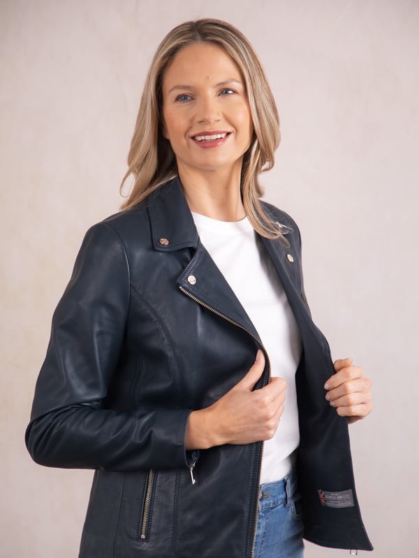 Knotts Leather Biker Jacket in Navy Blue The Knotts biker is a fresh update to the much-loved Kylee style, now introduced in two versatile shades.
Crafted from the finest semi aniline leather, this jacket embodies Lakeland Leather's commitment to quality and timeless design. It retains the iconic biker jacket elements, including an asymmetrical zip fastening, classic lapels, as well as sleek tonal hardware.
With its slightly longer length, the Knotts jacket is as versatile as it is flattering. Effortlessly pair it with jeans for a relaxed edge or drape it over a flowing dress for a chic contrast. Designed to suit all ages and seasons, this is a wardrobe essential with enduring appeal.