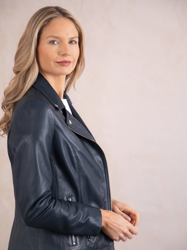 Knotts Leather Biker Jacket in Navy Blue The Knotts biker is a fresh update to the much-loved Kylee style, now introduced in two versatile shades.
Crafted from the finest semi aniline leather, this jacket embodies Lakeland Leather's commitment to quality and timeless design. It retains the iconic biker jacket elements, including an asymmetrical zip fastening, classic lapels, as well as sleek tonal hardware.
With its slightly longer length, the Knotts jacket is as versatile as it is flattering. Effortlessly pair it with jeans for a relaxed edge or drape it over a flowing dress for a chic contrast. Designed to suit all ages and seasons, this is a wardrobe essential with enduring appeal.