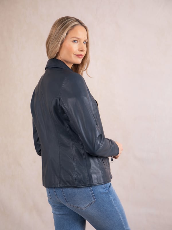 Knotts Leather Biker Jacket in Navy Blue The Knotts biker is a fresh update to the much-loved Kylee style, now introduced in two versatile shades.
Crafted from the finest semi aniline leather, this jacket embodies Lakeland Leather's commitment to quality and timeless design. It retains the iconic biker jacket elements, including an asymmetrical zip fastening, classic lapels, as well as sleek tonal hardware.
With its slightly longer length, the Knotts jacket is as versatile as it is flattering. Effortlessly pair it with jeans for a relaxed edge or drape it over a flowing dress for a chic contrast. Designed to suit all ages and seasons, this is a wardrobe essential with enduring appeal.