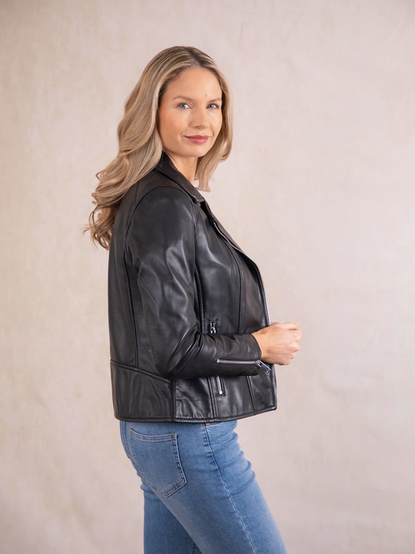 Tarraby Leather Biker Jacket in Black A timeless outerwear essential, the Tarraby reimagines the classic biker jacket with refined detailing for any occasion. Crafted from supple semi aniline leather, the Tarraby is effortlessly versatile, able to be dressed up or down as needed. Featuring an asymmetric zip fastening and iconic biker lapels and collar, it’s tailored to enhance your natural curves, creating a flattering, stylish silhouette.