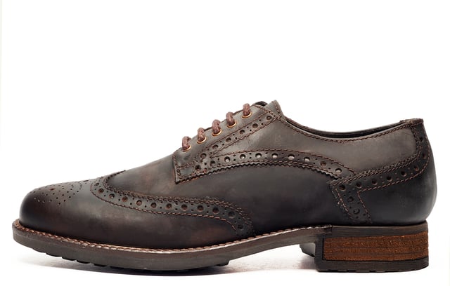 Catesby England was founded in 1970 with a vision and dedication focused on quality, craftsmanship, and a fine attention to detail. From its modest beginnings in a countryside workshop, Catesby England grew into a name synonymous with classic English footwear, blending heritage with modern craftsmanship, manufactured from the finest leathers to ensure durability, comfort, and effortless style.
 Where timeless elegance meets rugged practicality. The SE Catesby Appleby Brogues blend traditional brogue craftsmanship with a modern, outdoor-ready design. Crafted from premium leather, these shoes feature classic wingtip and brogue detailing for a refined aesthetic, while the robust rubber sole delivers superior grip and durability across varied terrains.
 Whether you're navigating city streets or country lanes, the Appleby ensures all-day comfort with its lace-up closure for a secure, adjustable fit. The addition of a wooded heel lends a touch of sophistication and stability, making these brogues a versatile choice for both smart-casual and formal wear.
 - Premium Waxy Leather upper
 - Brogue Detailing
 - Lace-Up Closure
 - Soft textile lining
 - Durable rubber sole
 - Catesby branding
 
 Please Note: These brogues have a dull vintage waxed finish. This is part of the new quality make up of the shoe and is not a fault. There may also be a stickly effect around the welt of the shoe which will wipe clean with a finger or smooth damp cloth. This is nothing more than residue which has been caused by humidity or storage during transportation.
