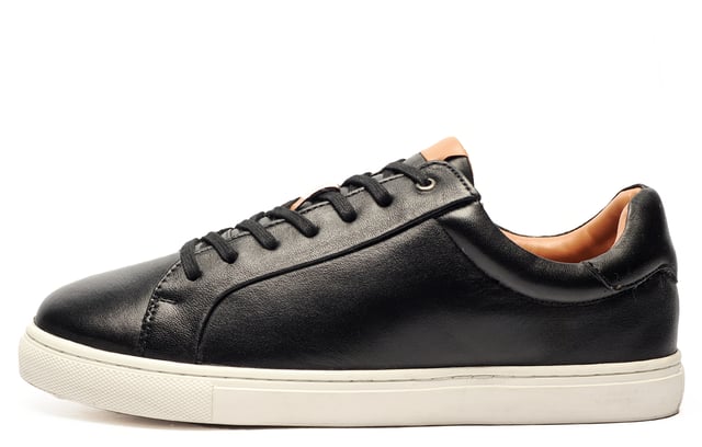 Catesby England was founded in 1970 with a vision and dedication focused on quality, craftsmanship, and a fine attention to detail. From its modest beginnings in a countryside workshop, Catesby England grew into a name synonymous with classic English footwear, blending heritage with modern craftsmanship, manufactured from the finest leathers to ensure durability, comfort, and effortless style.
 Crafted from premium leather, this must-have trainer blends sleek, casual design with all-day comfortperfect for wherever the day takes you. Whether youre dressing up for the office or keeping it cool on the weekend, the Catesby Hugo has you covered.
 With its subtly padded ankle collar, ultra-soft lining, and cushioned foam footbed, every step feels like a treat. Versatile, stylish, and endlessly wearablethis is the trainer your wardrobes been waiting for.
 - Premium leather upper
 - Lace fastening
 - Subtle Padded Collar for Added Comfort
 - Super Soft Cushion Comfort Insole
 - Durable outsole
 - Catesby branding