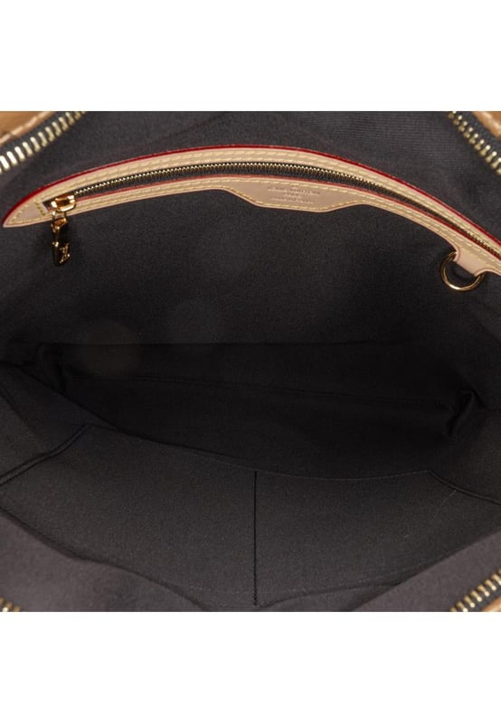 The Carry It features a printed reverse monogram canvas body flat vachetta leather shoulder straps a top zip closure and interior zip and slip pockets.Brand: Louis VuittonCondition: Pre-lovedType: Tote BagRating: AMain Material: CanvasDimensions (LxWxD): 38x37x4Strap Drop: 34Dust Bag: Yes