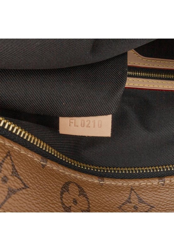 The Carry It features a printed reverse monogram canvas body flat vachetta leather shoulder straps a top zip closure and interior zip and slip pockets.Brand: Louis VuittonCondition: Pre-lovedType: Tote BagRating: AMain Material: CanvasDimensions (LxWxD): 38x37x4Strap Drop: 34Dust Bag: Yes