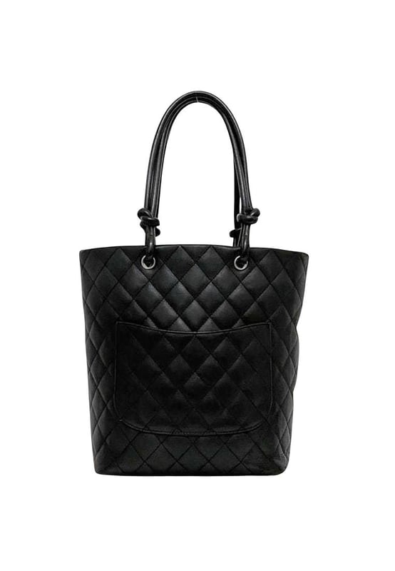 Brand: Chanel
Model: Cambon line
Color: Black
Material: Leather
Inclusions: /
Dimensions: 24.5cm x 20cm x 12cm
Serial number: 9445023
Country of origin: Italy
Condition: B - good condition.
This Chanel Cambon Line tote bag model A25166 is a chic accessory designed for women. Crafted from the iconic Cambon ligne material in black and white it features a spacious design with two zipper pockets and two pen holders inside.
The bag shows slight overall scratches and dirt with noticeable rubbing on the corners and some stains on the exterior. There are also scuff marks throughout but it remains a stylish and functional tote.
We recommend that you look at all the pictures before making your purchase to ensure that you are satisfied with the condition of the item.Brand: ChanelType: toteMain Material: Leather