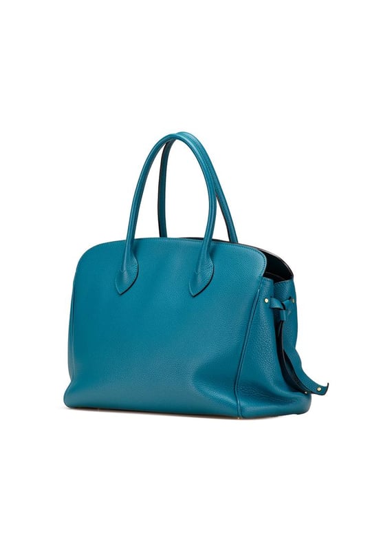 The Milla MM features a leather body rolled leather handles an open top with a lobster hook and twist lock closure an interior zip compartment and interior slip pockets.Brand: Louis VuittonCondition: Pre-lovedType: SatchelRating: B+Main Material: LeatherDimensions (LxWxD): 25x38x15Handle Drop: 13Dust Bag: YesComments: Lock Scratched. Exterior Corners Worn. Exterior Front Scratched. Exterior Handle Cracked Creased Worn. Interior Pocket Scratched. Interior Pocket stained with Other. Key Scratched. Interior Lining Scratched. Interior Lining stained with Other. Practical Attachment Scratched. Exterior Side Out Of Shape Worn. Exterior Top Worn. Zipper Scratched.