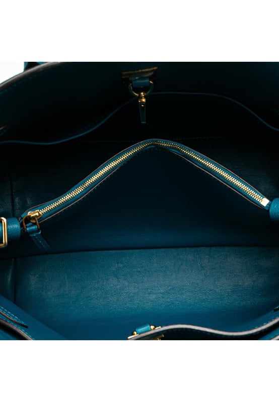 The Milla MM features a leather body rolled leather handles an open top with a lobster hook and twist lock closure an interior zip compartment and interior slip pockets.Brand: Louis VuittonCondition: Pre-lovedType: SatchelRating: B+Main Material: LeatherDimensions (LxWxD): 25x38x15Handle Drop: 13Dust Bag: YesComments: Lock Scratched. Exterior Corners Worn. Exterior Front Scratched. Exterior Handle Cracked Creased Worn. Interior Pocket Scratched. Interior Pocket stained with Other. Key Scratched. Interior Lining Scratched. Interior Lining stained with Other. Practical Attachment Scratched. Exterior Side Out Of Shape Worn. Exterior Top Worn. Zipper Scratched.