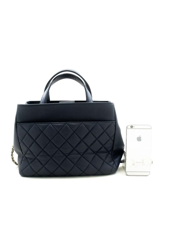 Brand: Chanel
Model: Business Affinity
Color: Navy
Material: Leather
Inclusions: 
Dimensions: W 26.3 cm x H 20 cm x D 11.7 cm
Serial number: 27354643
Country of origin: Italy
Condition: AB - good condition.
Outside condition : Slight scratches slight misshapen
Inside condition : Slight dirt
Handle condition : Slight crease
Corner condition : Good
Metal fittings condition : GoodBrand: ChanelType: shoulderMain Material: Leather