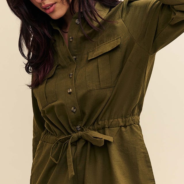 Womens Nobody's Child Miranda Utility Playsuit in khaki green.Lighten up. Long sleeves are accompanied by a soft tie waist and cargo style patch pockets. Swing a straw bag over your arm and go. - Collar - Long sleeves- Pockets - Button front- Drawstring waist- 69% Organic Cotton  31% Linen.  Machine washable.- Ref: P240250GRN