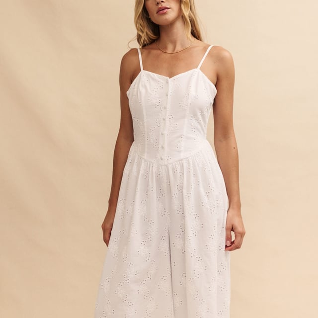 Womens Nobody's Child Tricia Broderie Anglaise Jumpsuit in white.So effortless.  Here’s another white jumpsuit to add to your collection. Featuring broderie anglaise embroidery all over  Tricia is framed by a corset-inspired dipped waist that flares out into a breezy wide leg cut. Style yours with summer sandals.- Adjustable spaghetti straps - Covered buttons- Shirred sides for comfort - Wide leg cut that skims the body - Lightly lined so the fabric falls beautifully- Size tip: we recommend your usual size- 85% Birla Lyocell™  15% Linen.  Machine washable.- Ref: P240880WHT