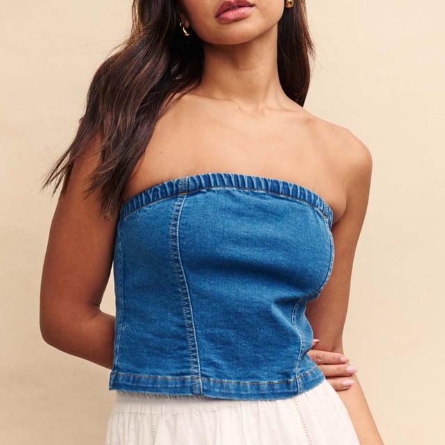 Spring is here. This structured bandeau is perfect for sun-filled celebrations in blue denim. Made from organic cotton blended with a touch of stretch  it's sure to frame your figure in all the right places.  Elevate yours with gold jewellery. - Concealed zip fastening - Designed for a close cut.- Ref: D240726BLU