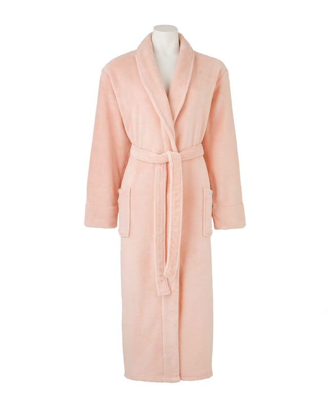 A beautifully soft fleece dressing gown in dusky pink. Lightweight yet warm enough for cold winter nights. Featuring a shawl collar, patch pockets and belted waist. 100% super soft polyester. Lightweight. 2 patch pockets. Length 120cm approx.. Back neck hanging loop. Machine washable at 40°C.