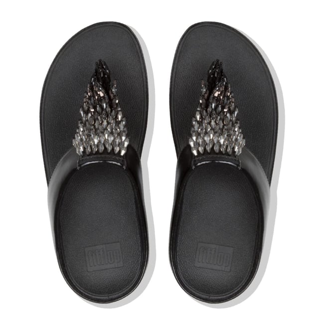 Dames FitFlop Rumba Ombre Toe-Thong Sandalen in zwart.Doe de Rumba...met deze glinsterende sierlijke teen-post sandalen. Het slanke bovenwerk is bezaaid met een glanzende zwierige franje van veelkleurige 'kristallen' kralen (helder gekleurd en metallic). Op FitFlop's legendarische Microwobbleboard™ tussenzolen voor onovertroffen comfort en demping, de hele dag door. Trek ze aan en ga op zoek naar een feestje! Hier in zacht metallic kunstleer.Ref: Z18090