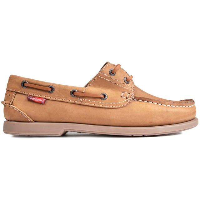 The Marine Bow boat shoe from Chatham Marine is ideal for those smart-casual days around town, casual evenings with friends and of course a warm breezy day out at sea. The superb light tan nubuck upper is of the highest quality and the moccasin-style slip-ons have a flexible rubber sole and brass metal eyelets around the sides to complete this luxurious look.