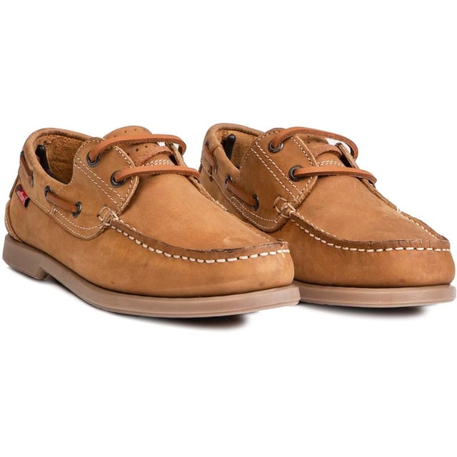 The Marine Bow boat shoe from Chatham Marine is ideal for those smart-casual days around town, casual evenings with friends and of course a warm breezy day out at sea. The superb light tan nubuck upper is of the highest quality and the moccasin-style slip-ons have a flexible rubber sole and brass metal eyelets around the sides to complete this luxurious look.