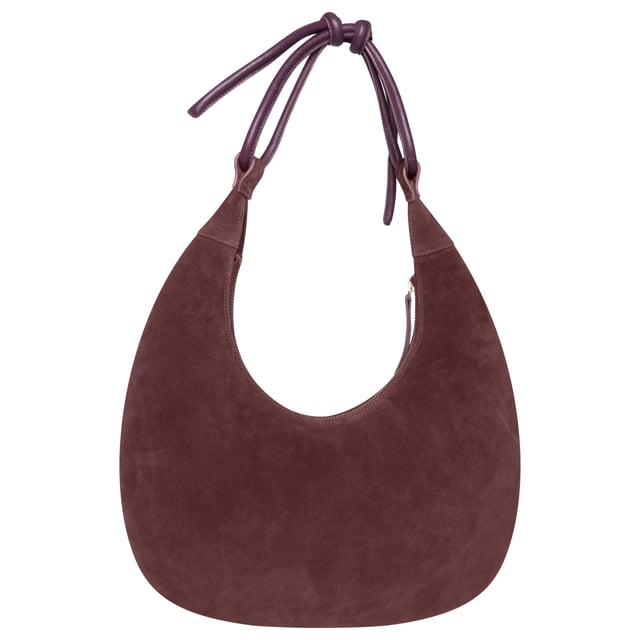 Make a statement with this unique circular shoulder bag from Barneys Originals, crafted from rich burgundy suede with premium leather detailing. The structured design helps the bag retain its shape, while the soft leather tie strap offers a touch of effortless elegance. Finished with a sleek gold zip closure, this bag is a standout piece that adds depth and texture to any outfit – perfect for both everyday use and special occasions.