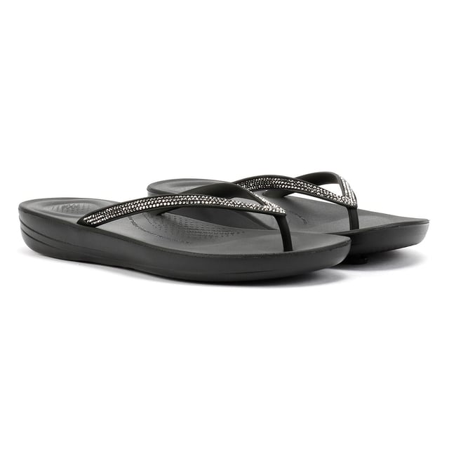 FitFlop Iqushion Sparkle Rubber Women's Black Flip Flops Waterproof ergonomic flip-flops with a durable rubber upper and anatomically shaped straps for a secure fit adorn with micro-crystals . Designed with a contoured footbed to support natural alignment and reduce toe gripping. Lightweight, flexible, and perfect for beach days, poolside lounging, or everyday summer wear.