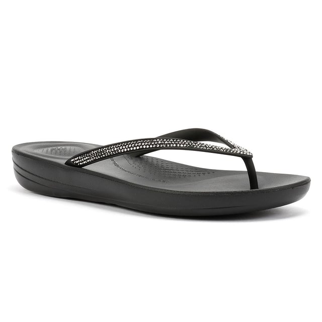 FitFlop Iqushion Sparkle Rubber Women's Black Flip Flops Waterproof ergonomic flip-flops with a durable rubber upper and anatomically shaped straps for a secure fit adorn with micro-crystals . Designed with a contoured footbed to support natural alignment and reduce toe gripping. Lightweight, flexible, and perfect for beach days, poolside lounging, or everyday summer wear.