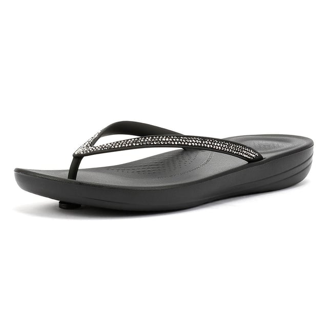 FitFlop Iqushion Sparkle Rubber Women's Black Flip Flops Waterproof ergonomic flip-flops with a durable rubber upper and anatomically shaped straps for a secure fit adorn with micro-crystals . Designed with a contoured footbed to support natural alignment and reduce toe gripping. Lightweight, flexible, and perfect for beach days, poolside lounging, or everyday summer wear.