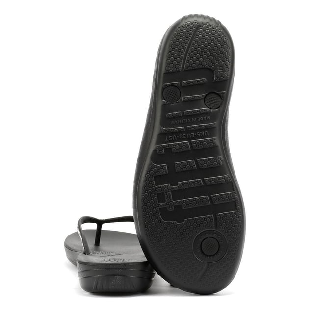 FitFlop Iqushion Sparkle Rubber Women's Black Flip Flops Waterproof ergonomic flip-flops with a durable rubber upper and anatomically shaped straps for a secure fit adorn with micro-crystals . Designed with a contoured footbed to support natural alignment and reduce toe gripping. Lightweight, flexible, and perfect for beach days, poolside lounging, or everyday summer wear.