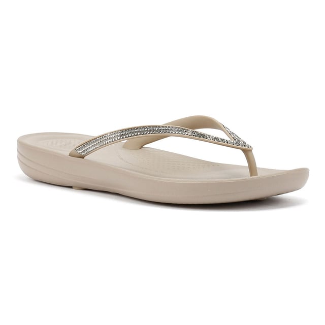 FitFlop Iqushion Ombre Sparkle Women's Taupe/Pewter Flip Flops Waterproof ergonomic flip-flops with a durable rubber upper and anatomically shaped straps for a secure fit adorn with micro-crystals . Designed with a contoured footbed to support natural alignment and reduce toe gripping. Lightweight, flexible, and perfect for beach days, poolside lounging, or everyday summer wear.