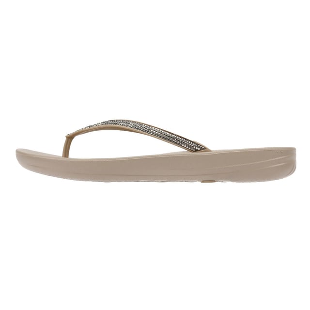 FitFlop Iqushion Ombre Sparkle Women's Taupe/Pewter Flip Flops Waterproof ergonomic flip-flops with a durable rubber upper and anatomically shaped straps for a secure fit adorn with micro-crystals . Designed with a contoured footbed to support natural alignment and reduce toe gripping. Lightweight, flexible, and perfect for beach days, poolside lounging, or everyday summer wear.