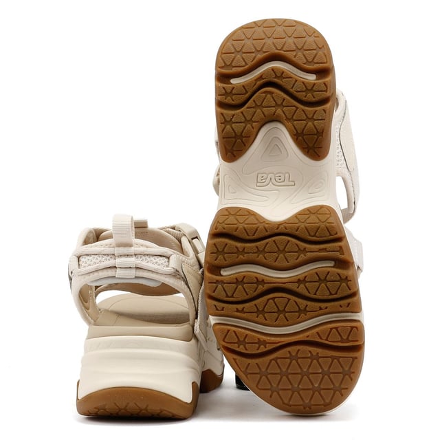 Elevated platform sandals featuring an archival-inspired upper with quick-dry, padded straps for all-day comfort. Crafted with a lightweight EVA footbed and a durable rubberized outsole for reliable traction. Made using 100% REPREVE® recycled polyester webbing a sustainable, eco-friendly choice.