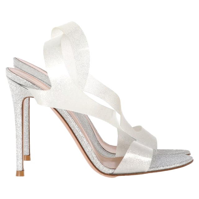VINTAGE, RRP AS NEW
The Gianvito Rossi Metropolis Sandal Heels in Silver Polyurethane radiate contemporary elegance, featuring clear straps and a reflective silver stiletto for a barely-there, high-shine effect. Designed to elongate the leg and elevate any outfit, these sandals blend modern materials with timeless glamour. Style tip: Style them with a minimalist gown or a sharp tailored set to let the heels take center stage with their sleek, architectural appeal.

 Gianvito Rossi Metropolis Sandal Heels in Silver Polyurethane

Condition: Excellent
Signs of wear: No visible sign of wear. No Mark at insole.,  Very light mark at soles.
Packaging: None
Color: Silver
Material: Polyurethane
Size: IT | 37
Measurements: Heel height: 110; Insole length: 240
SKU: NAPPUGBSH483142W