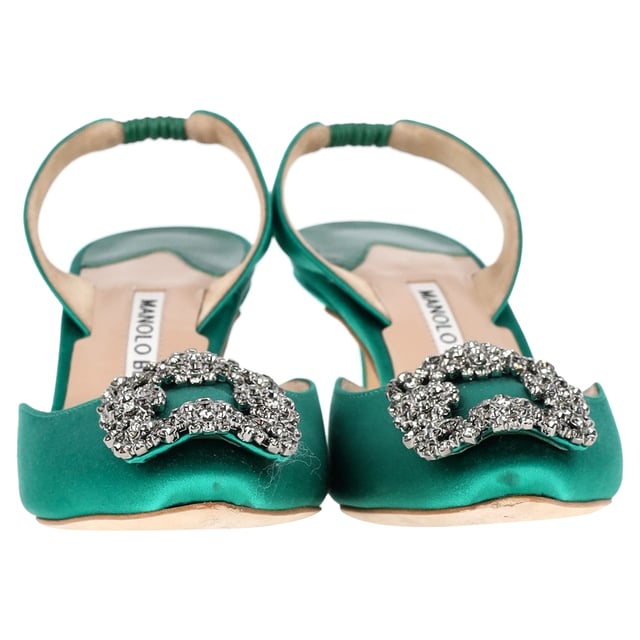VINTAGE, RRP AS NEW
 Add a touch of luxury and glamour to your footwear collection with the Manolo Blahnik Hangisi 70 Embellished Slingback Pumps in Green Satin. These exquisite pumps are crafted from rich green satin that exudes opulence, while the sleek 70mm heel offers a perfect balance of height and comfort. The standout feature is the intricate embellishment at the toe, adding a dose of sparkle and sophistication to every step you take.

Manolo Blahnik Hangisi 70 Embellished Slingback Pumps in Green Satin

Condition: Very good
Signs of wear: Include Box., Minor markings, Lightly used but very well maintained. Minor mark at soles & creasing, light scuffing at the soles and heels.
Packaging: Box, Dust bag
Color: Green 
Material: Satin 
Size: IT34.5/UK1.5/FR35.5/US4.5/EU34.5
Measurements: Heel height: 80; Insole length: 260
SKU: NAPPUGBSH429005W